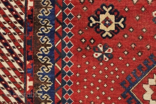 Antique large kazak with a dazzling field of tiny ivory stars. The spacious field framed with an unusual eye catching striped border and a matching pair of archaic trefoill minors. All beautiful  ...