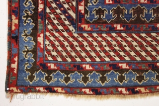 Antique large kazak with a dazzling field of tiny ivory stars. The spacious field framed with an unusual eye catching striped border and a matching pair of archaic trefoill minors. All beautiful  ...