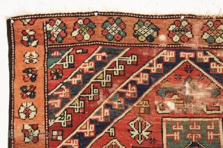 early small west anatolian rug. Old enough to have presence. All good colors. Damaged but complete. Waiting to be mounted or restored properly. Good age. First half 19th c. 4' x 4'9"  ...