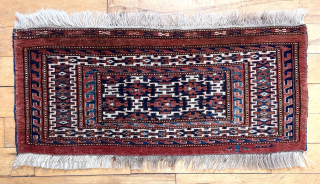 Antique turkman small torba or kap with a little turkman and his rather flat horse in the skirt. Good field and border designs and thick pile. All natural colors. Reasonably clean. 19th  ...
