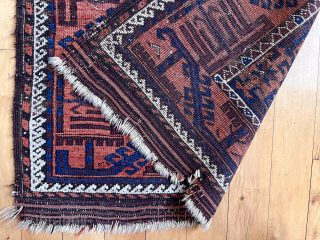 Antique Baluch rug in decent condition for the age. Some low pile and brown oxidation. Uncommon field design of diagonal bands of large latch hooked devises with star centers. Original goat hair  ...