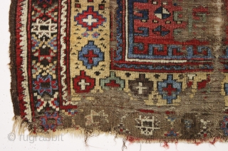 Early Turkish or perhaps Kurdish prayer rug. Interestingand unusual older example in very rough condition. Beautiful natural colors. Fleecy wool. Bits of old crude repair. Could be restored. Good age, ca. 1850.  ...