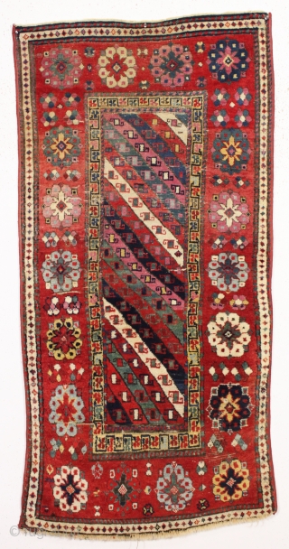 antique  little caucasian rug with very rich saturated natural colors. Fresh New England find. As found with mostly good pile, some creases, few small spots of wear as shown. All natural  ...