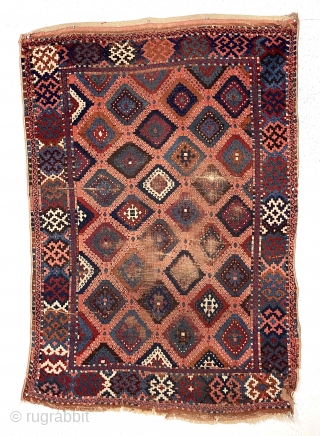 Antique east Anatolian yoruk or sarkisla rug with classic “baklava” design. Older example with fine weave and all natural colors featuring a pretty apricot ground. As found, dirty and in need of  ...