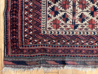 Antique camel ground Baluch prayer rug. Well drawn tree of life design. Good even medium pile with soft lustrous wool. Natural colors. Slight black oxidation. Original goat hair selvages. Several small holes.  ...