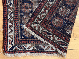 Old Baluch square middle Bagface in ghostly worn condition but with some interesting design features. Unusually large medallion and not the typical field I associate with the type. Natural colors. Rough and  ...