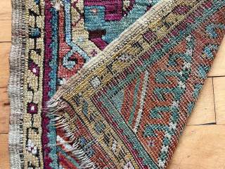 Antique Anatolian yastik in good condition for the age. Mostly good pile with moderately oxidized blacks. Natural colors including multiple blues, good yellows and a rich cochineal red/purple. Original selvages. Ends unraveling  ...