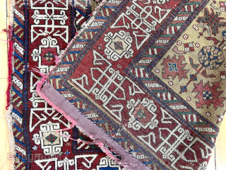 If only the entire rug was like this. Early east Caucasian long rug with lovely deep yellow ground. Unfortunately areas of very heavy wear and damages. Edges all rough as shown. Soft  ...