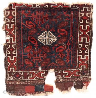 Antique Baluch bagface. Bold design. Great border. All natural colors. Low pile. Big knots. Attacked by wolves and damaged as shown. 19th c. 27" x 28"       