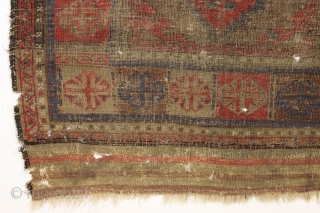 Antique baluch. Interesting large scale design. Nice reds. If wear is age then this one is ancient. Many many tiny moth nibbles and tiny holes, and hard to tell the front from  ...
