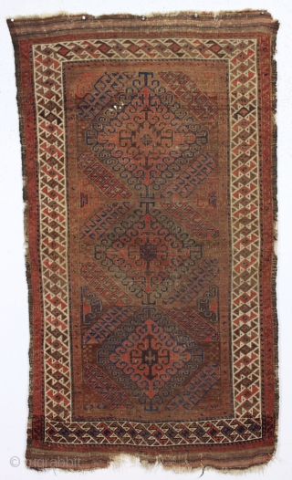 antique little baluch rug. Classic older mushwani type with latch hooked design and all good colors. As found this week, very dirty with allover low pile and a few tiny old holes  ...