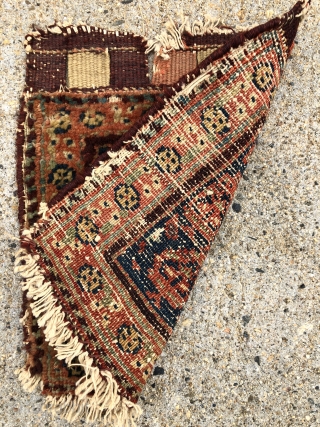 Antique tiny bagface. As found, in need of a good wash. Mostly good pile, some wear as shown. Original closure tabs. Edges rough. Single wefted, cotton warped, probably northwest Persian. Good natural  ...