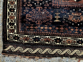 Antique large Baluch bagface with an attractive and rare design. Original selvages and remnant fancy ends. Very low pile with wear as shown. Natural colors. As found, in need of a good  ...