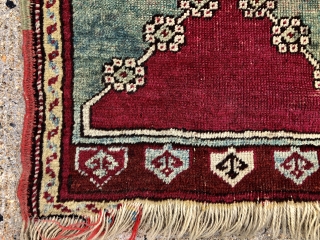 Antique Anatolian yastik in fair condition with very nice greens. Mostly decent pile with some light to moderate wear as shown. Original selvages. Natural colors including cochineal reds and real greens. As  ...