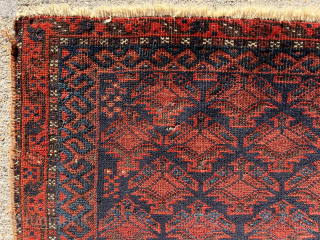 Early blue ground Baluch bagface with an overall lattice of floral pendants seen most often in so called “Dohktar i Ghazi” prayer rugs. Mostly decent pile. Few small old moth nibbles. Some  ...