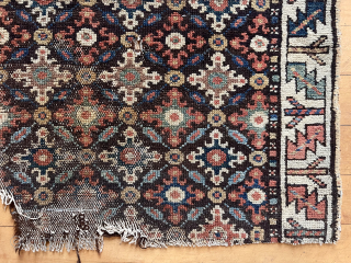 Old fragment of a northwest Persian rug with interesting cloud band motifs. Good old colors. Single wefted. Note the mixed warps with a section in dark brown wool. A fragment I have  ...