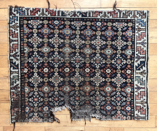 Old fragment of a northwest Persian rug with interesting cloud band motifs. Good old colors. Single wefted. Note the mixed warps with a section in dark brown wool. A fragment I have  ...