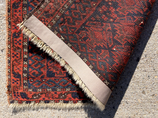 Early blue ground Baluch bagface with an overall lattice of floral pendants seen most often in so called “Dohktar i Ghazi” prayer rugs. Mostly decent pile. Few small old moth nibbles. Some  ...