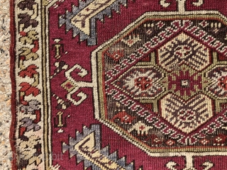 Antique Anatolian yastik. Nicely drawn “saz leaf” design with overall good even low pile. Likely Kersehir. Some heavy brown oxidation. Original selvages, a bit rough. Ends unraveling. Very colorful with no dye  ...