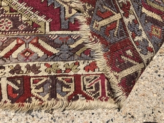 Antique Anatolian yastik. Nicely drawn “saz leaf” design with overall good even low pile. Likely Kersehir. Some heavy brown oxidation. Original selvages, a bit rough. Ends unraveling. Very colorful with no dye  ...