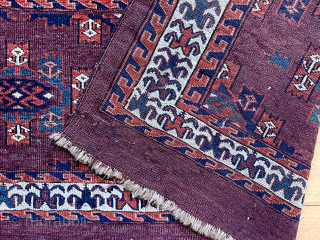 Antique deep purple ground yomud kepse gul torba or kap with fine old colors featuring pretty blue greens. Nice glossy wool. Classic field paired with an attractive uncommon flowering plant border. Reasonably  ...