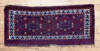 Antique deep purple ground yomud kepse gul torba or kap with fine old colors featuring pretty blue greens. Nice glossy wool. Classic field paired with an attractive uncommon flowering plant border. Reasonably  ...