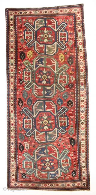 Antique lenkoran long rug in overall good condition. Classic design done with a flare, the angled medallions seem to be swimming and wiggling down through the field. Vibrant all natural colors including  ...