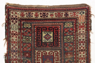 early ghost of a kazak rug. Splash of karrabaugh with a hint of karachopf. Indescribable condition. Priced accordingly. All good natural colors and reasonably clean. 3'6" x 8'3"     