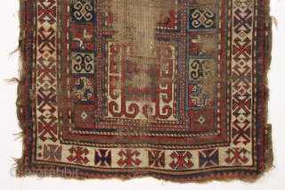 early ghost of a kazak rug. Splash of karrabaugh with a hint of karachopf. Indescribable condition. Priced accordingly. All good natural colors and reasonably clean. 3'6" x 8'3"     