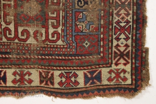 early ghost of a kazak rug. Splash of karrabaugh with a hint of karachopf. Indescribable condition. Priced accordingly. All good natural colors and reasonably clean. 3'6" x 8'3"     