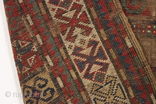 early ghost of a kazak rug. Splash of karrabaugh with a hint of karachopf. Indescribable condition. Priced accordingly. All good natural colors and reasonably clean. 3'6" x 8'3"     