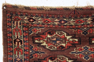 antique yomud chuval with an interesting skirt. All natural colors featuring a very nice light blue. Good minors and guard borders. As found, very dirty with scattered wear and a crudely repaired  ...