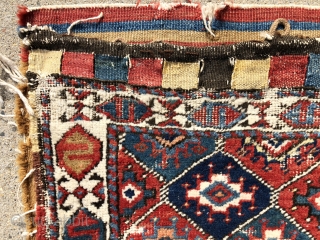 Antique complete northwest Persian bag with some unusual design features and great color. Unfortunately in rough condition. The  uncommon field of “memling” or turreted guls and extra wide ivory border with  ...