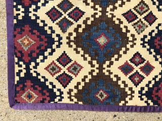 Antique little Anatolian kelim fragment. Pretty little ivory ground remnant. Reasonably clean. Cloth edging all around. All natural colors. Mostly good condition, one corner a bit tattered. 19th c. 24” x 28” 