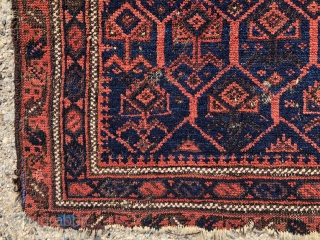 Antique little Baluch bagface with classic lattice and inset flowering plants. Better than average drawing and natural colors for this well known type. Excellent light blues and attractive reds. Unfortunately in somewhat  ...