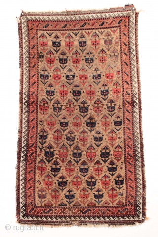 Antique small Baluch rug. Soft, supple and sophistacated. Older piece with very delicate drawing. All natural colors including a beautiful soft purple. Camel wool ground. Fair condition for the age with some  ...