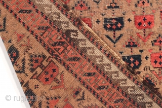 Antique small Baluch rug. Soft, supple and sophistacated. Older piece with very delicate drawing. All natural colors including a beautiful soft purple. Camel wool ground. Fair condition for the age with some  ...