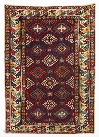 Antique very colorful little caucasian rug in good condition. Eye catching "dragons tooth" border. All good saturated natural colors featuring beautiful greens, multiple blues and nice old yellows and golds. Original selvages.  ...