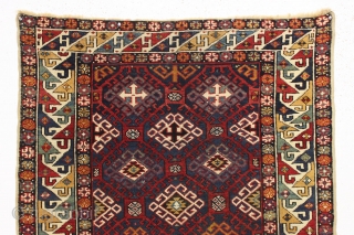 Antique very colorful little caucasian rug in good condition. Eye catching "dragons tooth" border. All good saturated natural colors featuring beautiful greens, multiple blues and nice old yellows and golds. Original selvages.  ...
