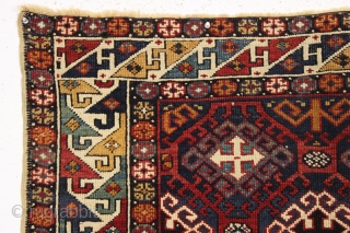 Antique very colorful little caucasian rug in good condition. Eye catching "dragons tooth" border. All good saturated natural colors featuring beautiful greens, multiple blues and nice old yellows and golds. Original selvages.  ...