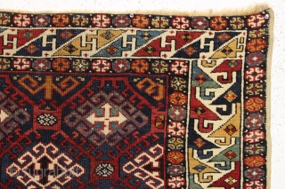 Antique very colorful little caucasian rug in good condition. Eye catching "dragons tooth" border. All good saturated natural colors featuring beautiful greens, multiple blues and nice old yellows and golds. Original selvages.  ...