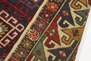 Antique very colorful little caucasian rug in good condition. Eye catching "dragons tooth" border. All good saturated natural colors featuring beautiful greens, multiple blues and nice old yellows and golds. Original selvages.  ...