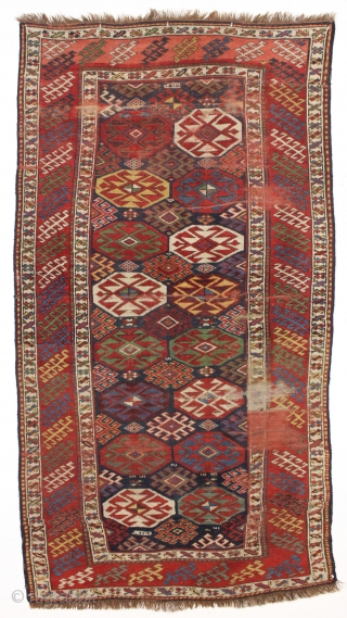 antique blue ground kazak with an allover design and a very unusual border. "as found", dirty with areas of wear as shown. Mostly fair even pile. Very fine saturated natural colors including  ...