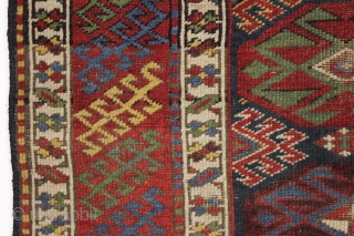antique blue ground kazak with an allover design and a very unusual border. "as found", dirty with areas of wear as shown. Mostly fair even pile. Very fine saturated natural colors including  ...