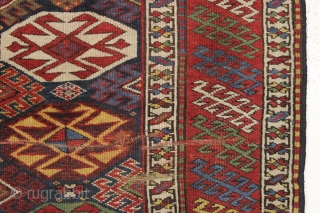 antique blue ground kazak with an allover design and a very unusual border. "as found", dirty with areas of wear as shown. Mostly fair even pile. Very fine saturated natural colors including  ...