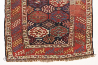 antique blue ground kazak with an allover design and a very unusual border. "as found", dirty with areas of wear as shown. Mostly fair even pile. Very fine saturated natural colors including  ...