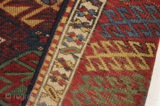 antique blue ground kazak with an allover design and a very unusual border. "as found", dirty with areas of wear as shown. Mostly fair even pile. Very fine saturated natural colors including  ...