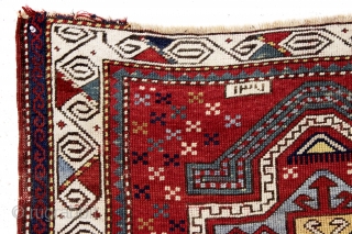 antique little kazak prayer rug. Interesting design featuring an eye catching border. All natural colors. inscribed date. As found with wear and slight edge roughness as shown. Restorable. Good age, ca. 1885.  ...