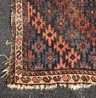 Antique Turkish knotted Baluch rug with an interesting and uncommon design. As found, in rough condition with heavy brown oxidation, wear, edge unraveling, loss. All natural colors. Nice floppy handle. Very dirty.  ...