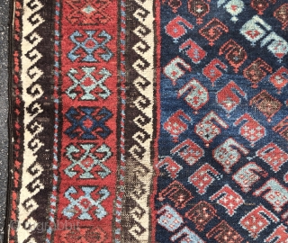 Antique Turkish knotted Baluch rug with an uncommon design and an unusual range of vibrant colors. Lovely multiple reds, light blues and greens. Mostly decent pile but one end has significant heavy  ...